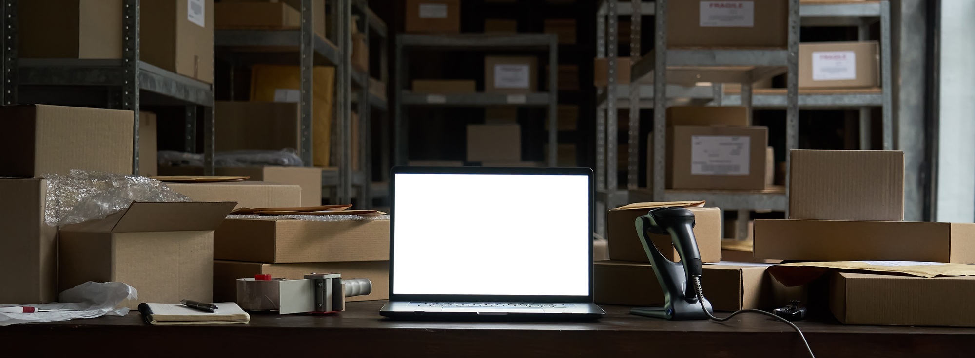 Table with laptop mock up screen and boxes, ecommerce online store shipping.